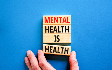 Mental health psychological symbol. Concept words Mental health is health on wooden blocks on a...