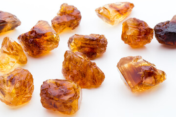 Brown caramelized sugar on white background.