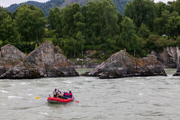 Rafting team splashing the waves, rafting extreme and fun sport in the river katun, altai mountains.