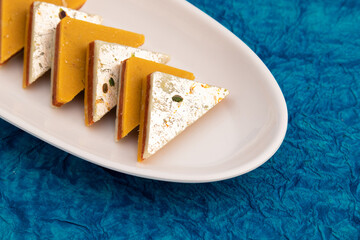 Indian Mithai Kaju Kesar Choco Gulkand Sandwich Burfi Also Known As Kajoo Barfi Is Diamond Shaped Sweet Made Of Cashew Nuts, Chocolate, Saffron, Mawa, Mava, Malai, Khoya, Doodh, Badam, Khoa, Pista