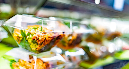 Ready to eat meals displayed in a commercial refrigerator