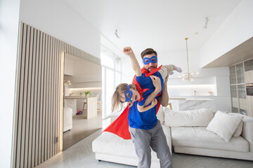 Father and son play superhero