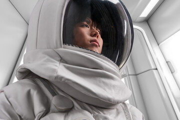 Female cosmonaut in futuristic spacesuit