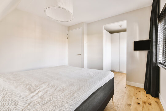 Soft bed in modern light bedroom