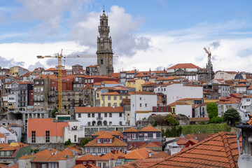 Skyline of the city of Porto seen from the tower of the cathedral. With a blue sky full of white clouds.