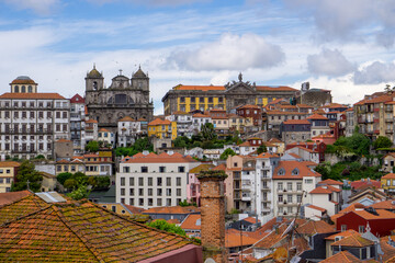 Naklejka na ściany i meble Skyline of the city of Porto seen from the tower of the cathedral. With a blue sky full of white clouds.