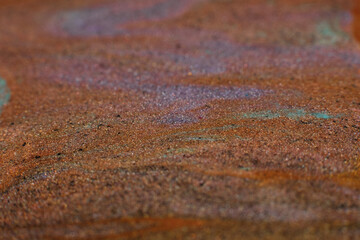 Mixing colors. Fluid magic. Creative painting. Brown sand effect glitter liquid paint blend
