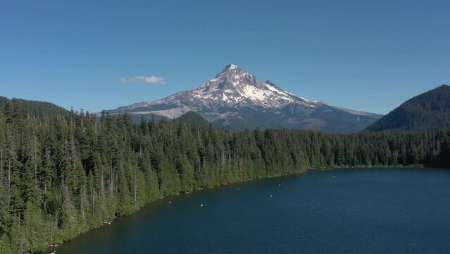 Aerial flying up and revealing Mt. Hood as seen from Lost Lake in Oregon.