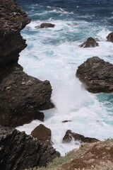 waves crashing on rocks
