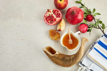 Rosh hashanah, jewish New Year holiday concept. Pomegranate, apples and honey traditional products...