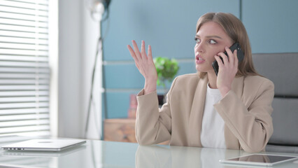 Businesswoman Talking Angrily on Smartphone