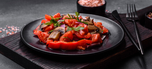 A salad of baked mushrooms, tomatoes, onions, parsley, spices and herbs