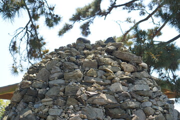 Stone tower piled high among pine trees