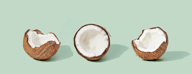 Coconut on green background. Food concept.