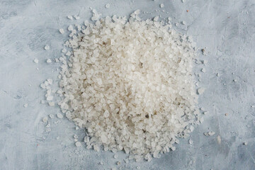 White sea salt in gray background