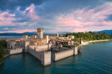 Rocca Scaligera Castle in Sirmione Lake Garda Italy. Aerial view. Sunrise at Rocca Scaligera Castle in Sirmione.