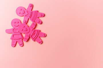 Preparing for Christmas. Pink cookie cutters isolated on a pink background. copy space