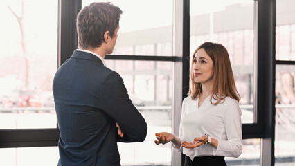 surprised and positive woman talking to employer during job interview.