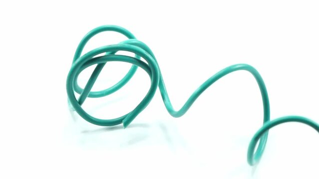 green wire cable of usb and adapter isolated on white background.Electronic Connector.Selection focus.Slow motion macro footage.