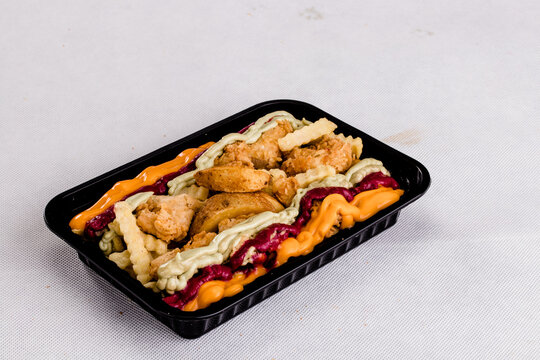 Joppie Fries Loaded Served In A Dish Isolated On Grey Background Side View