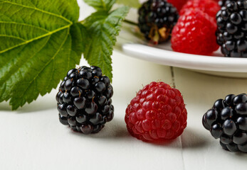 Organic berries of blackberries and raspberries on the table