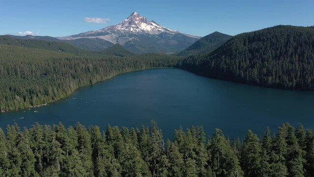 Aerial panning up and revealing a breathtaking scenic view of Mt. Hood and Lost Lake in Oregon.
