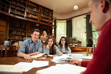 Group of students studying together at the University library