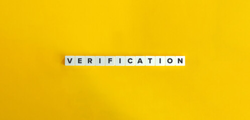 Verification Banner. Word on Block Letter Tiles on Yellow Background. Minimal Aesthetics.