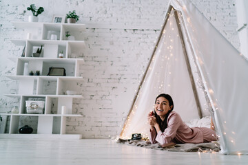 Asian woman lying and resting in wigwam tent © BullRun
