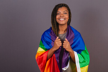 Young Afro Brazilian woman, wearing LGBT, LGBTQ, militancy, bisexual flag. diversity. Lesbian.