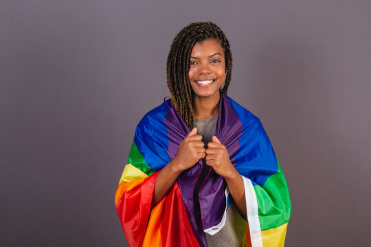 Young Afro Brazilian woman, wearing LGBT, LGBTQ, militancy, bisexual flag. diversity. Lesbian.