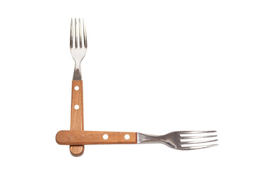 2 forks with wooden handles making the letter L on a white background