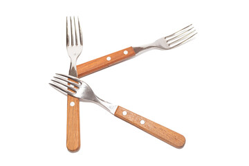 3 forks with wooden handles making the letter K on a white background
