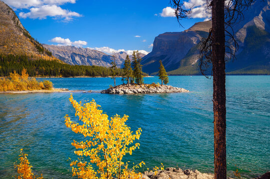 Small island with trees on Lake Minnewanka in Banff National Park, Canada