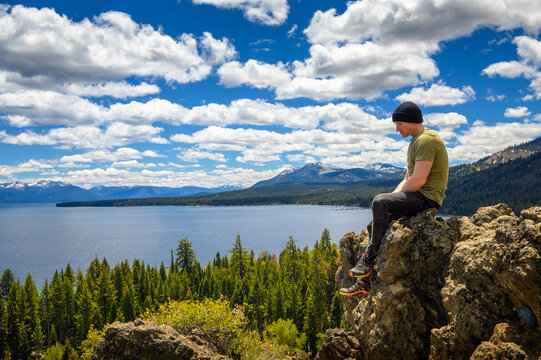 Hiker enjoying the view of Lake Tahoe from the Eagle Rock in California