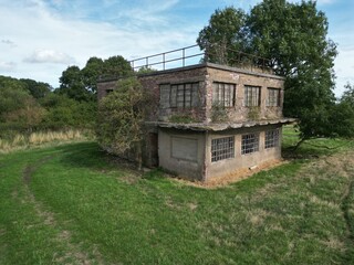 
Aerial view of World war two military airfield control tower at Forma RAF Woolfox Lodge Aerodrome. Rutland, England. Royal Air Force Woolfox Lodge or more simply RAF Woolfox Lodge 