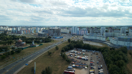 Obraz premium Multi-lane city highway. Multi-storey buildings in the suburbs. Aerial photography.