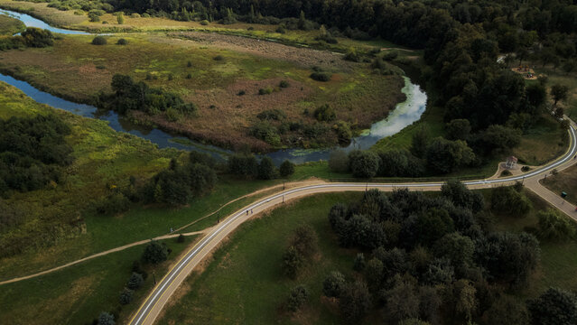 Winding bike path in the city park. City park at dawn. Aerial photography. © f2014vad