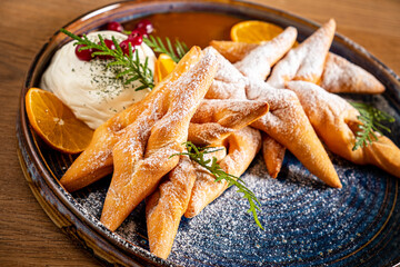 Faworki (angel wings) sprinkled with powdered sugar - traditional polish carnival delicacy