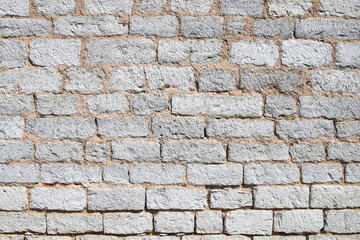 Texture of an old white stone wall made of gang-sawn limestone