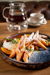 Faworki (angel wings) sprinkled with powdered sugar - traditional polish carnival delicacy