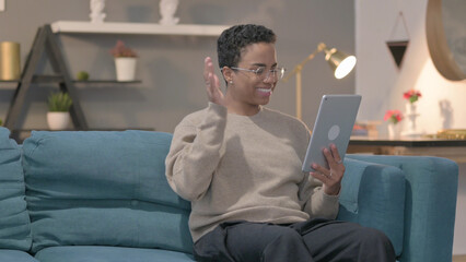 African Woman Talking on Video Call on Tablet on Sofa