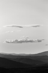 Fototapeta na wymiar View of Umbria valley and mountains with some clouds above them