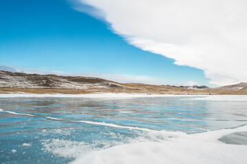 Fototapeta na wymiar frozen Lake Baikal and clear blue sky 