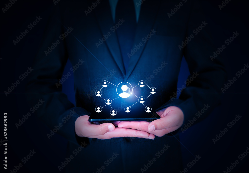 Poster networking concept background with connecting signs hovering over mobile in hand. businessman holdin