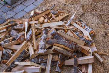 Close up view of birch firewood of different sizes for kindling fireplace. Sweden.
