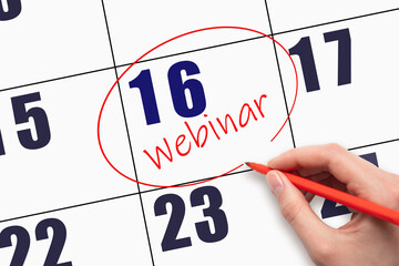 16th day of the month. Hand writing text WEBINAR and circling the calendar date.