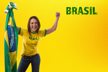 Female brazilian fan celebrating on a yellow background.