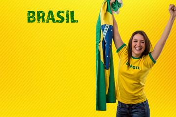 Female brazilian fan celebrating on a yellow background.