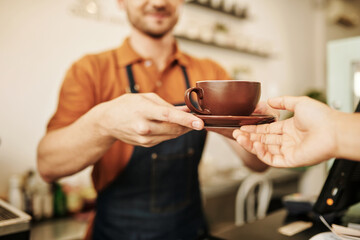Basita Giving Cappuccino to Customer